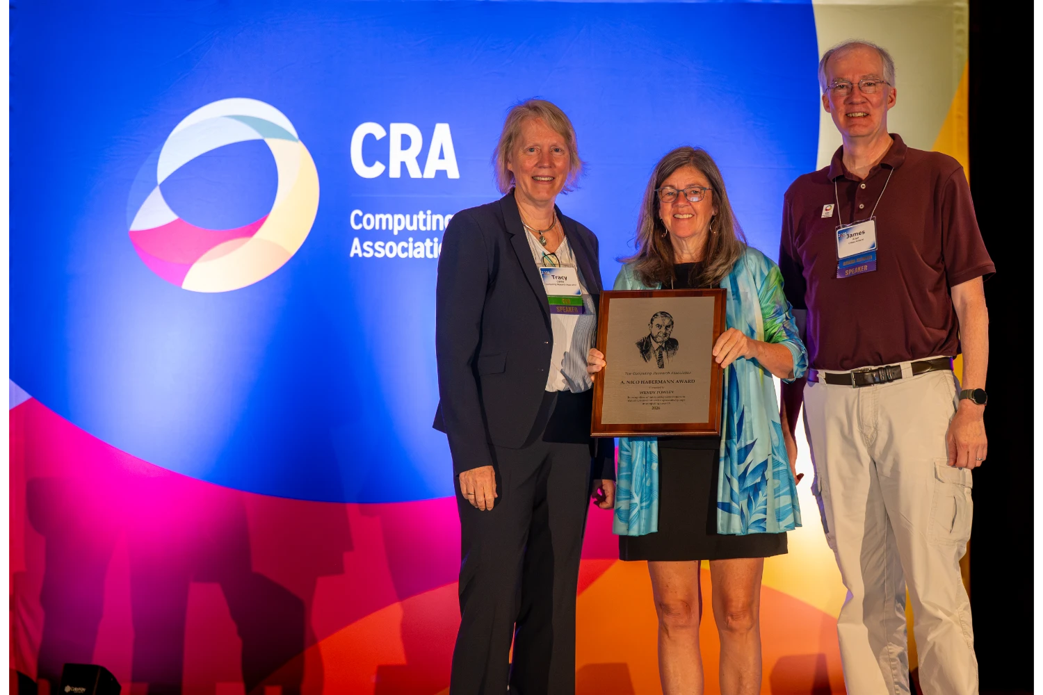Wendy Powley receiving the 2026 CRA A. Nico Habermann Award, standing with Tracy Camp and James Allan of the Computing Research Association.