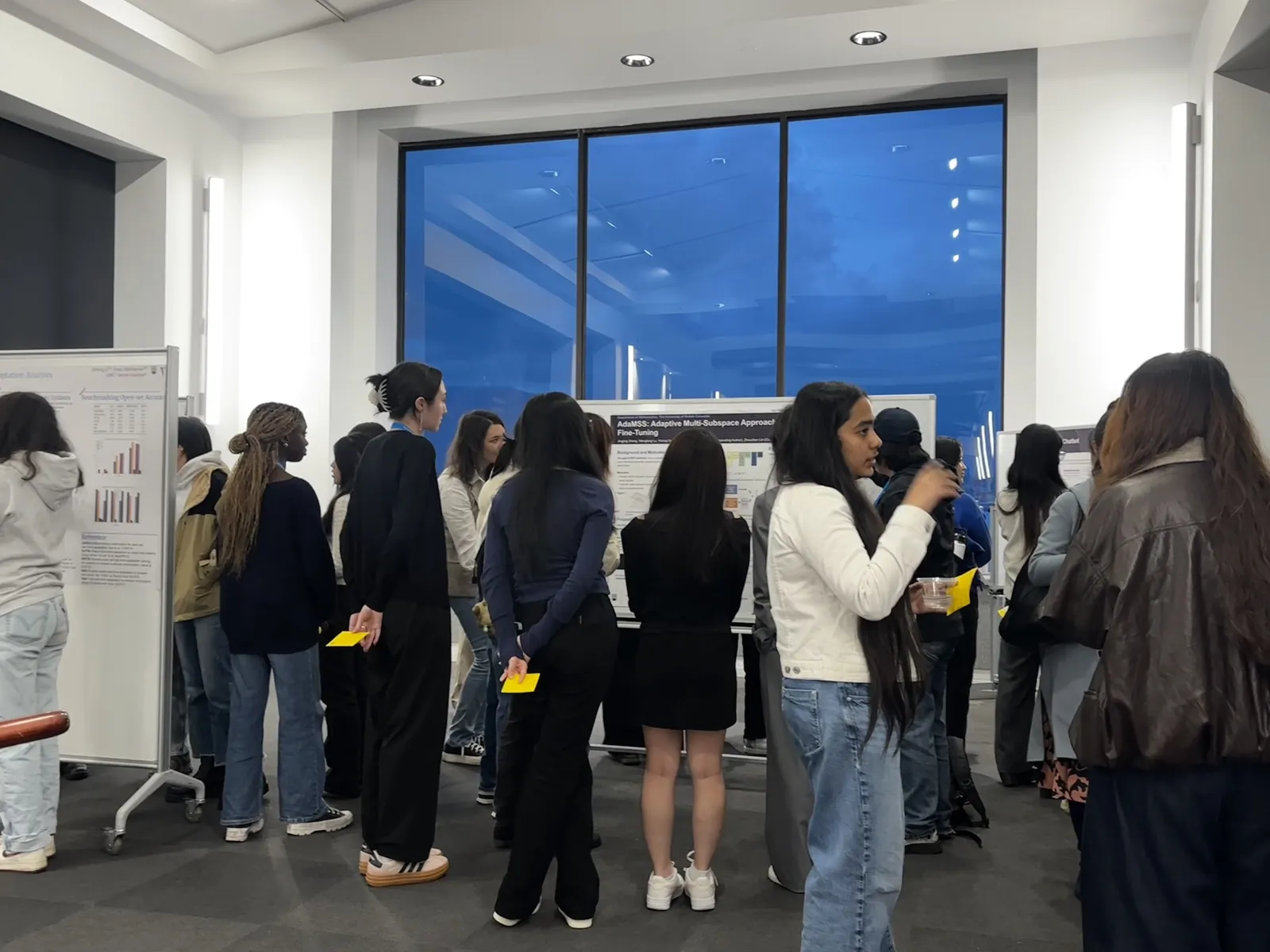 Students gathered around research posters during the CAN-CWiC West 2025 poster session