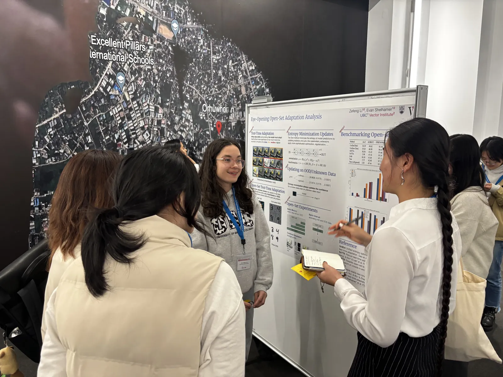 A student presenting her research poster to attendees at CAN-CWiC West 2025