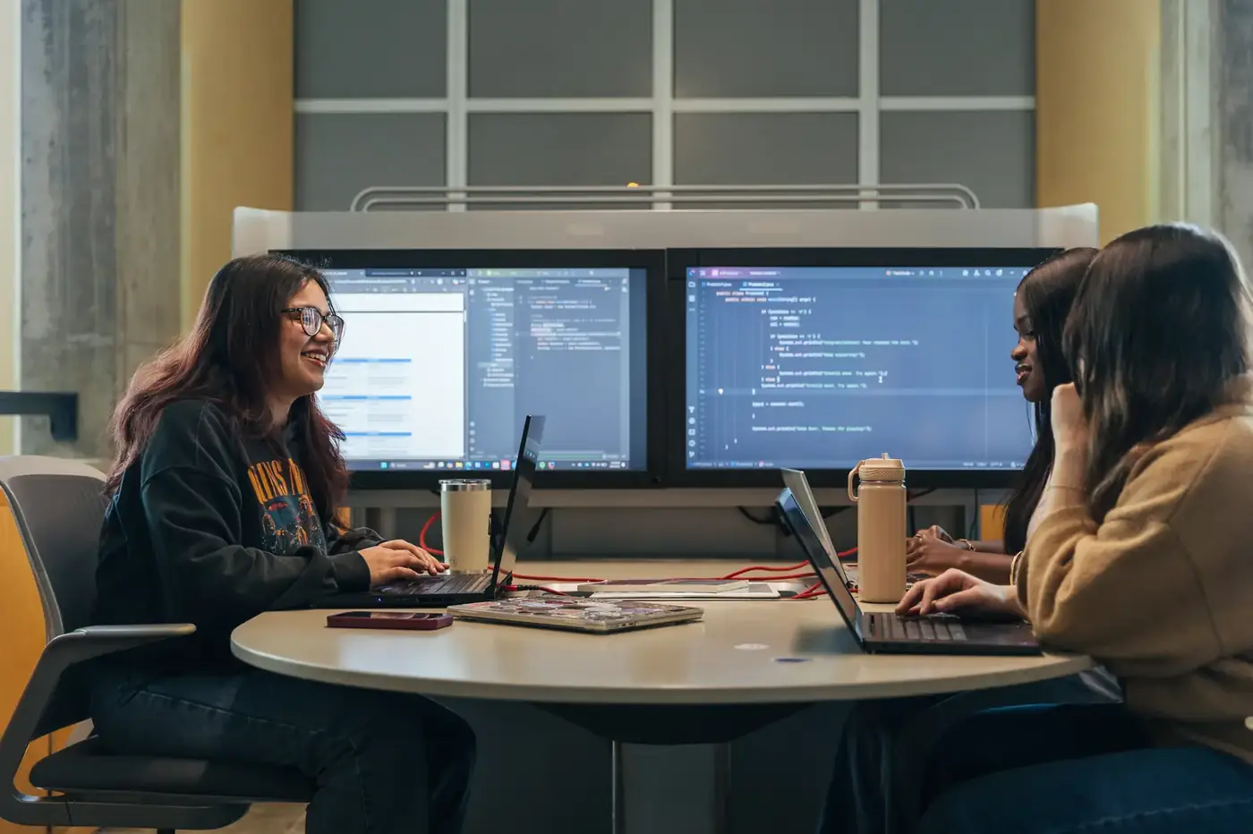 Computer science students coding together at Dalhousie University